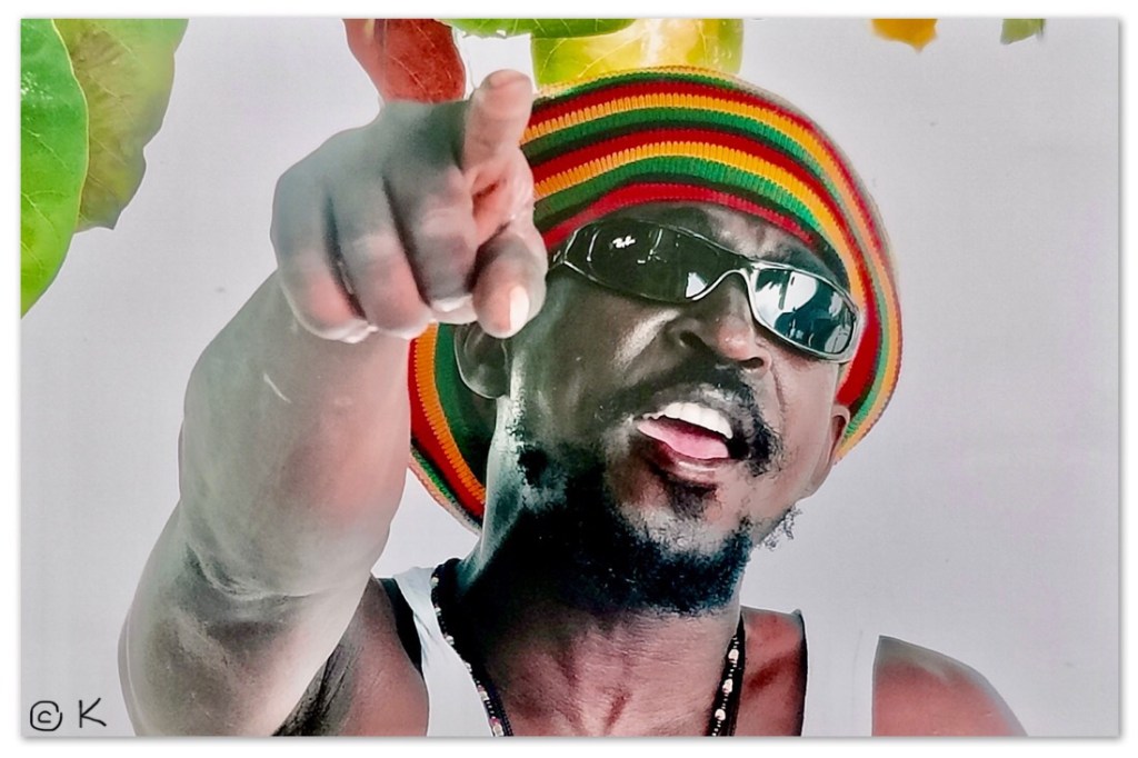 A local pointing with a Rastafarian hat / /Swimming with sharks and a stingray that purrs @ Kirsten K Kester | InsightandVisions.com
